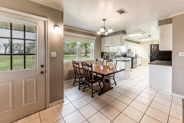 dining space with baseboards, visible vents, a notable chandelier, crown molding, and light tile patterned floors
