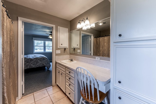bathroom with tile patterned floors, vanity, ceiling fan, and connected bathroom