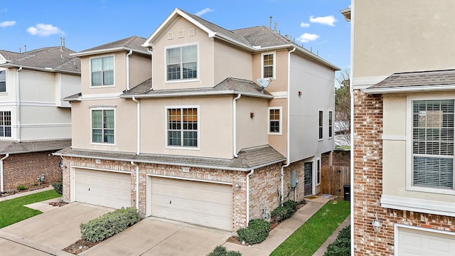 7818 Stoneyway Dr, Houston, TX 77040 - view of property featuring brick siding, an attached garage, concrete driveway, and stucco siding
