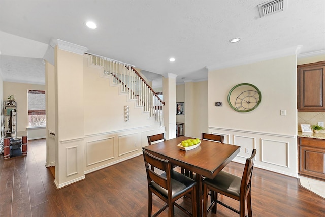7818 Stoneyway Dr, Houston, TX 77040 - dining room featuring a decorative wall, dark wood-style floors, and visible vents