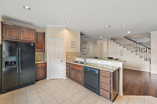 7818 Stoneyway Dr, Houston, TX 77040 - kitchen with black appliances, a peninsula, crown molding, and a sink
