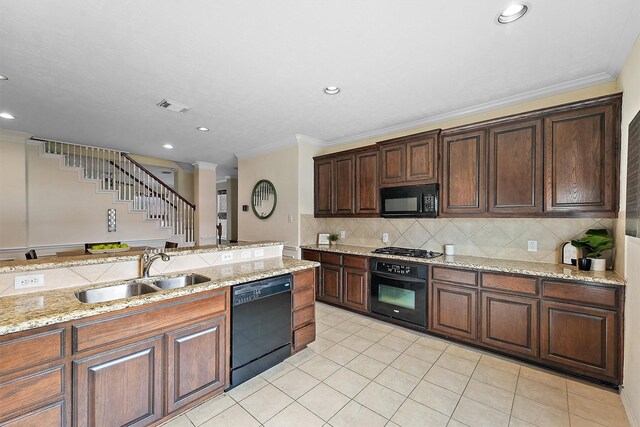 7818 Stoneyway Dr, Houston, TX 77040 - kitchen with black appliances, crown molding, a sink, and visible vents