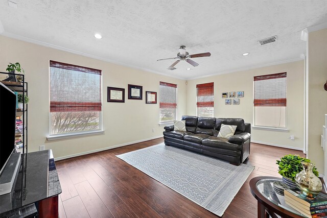 7818 Stoneyway Dr, Houston, TX 77040 - living room featuring a textured ceiling, crown molding, hardwood / wood-style flooring, and a ceiling fan