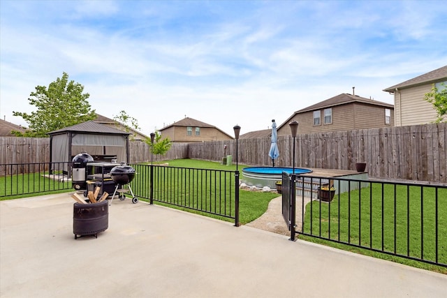 view of patio / terrace with a fenced backyard and a gazebo