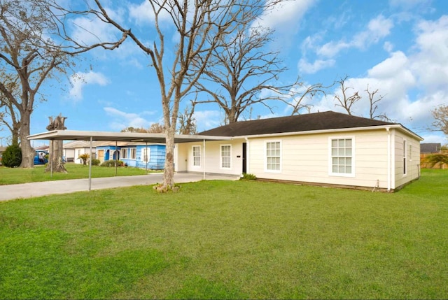 ranch-style house with driveway, a front lawn, and a carport