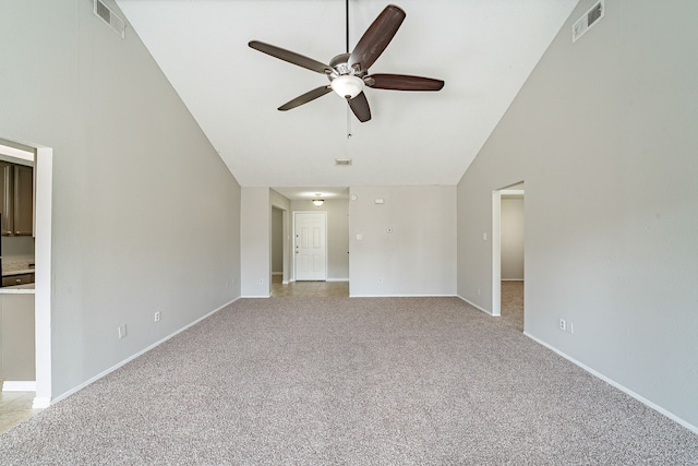 unfurnished living room with ceiling fan, visible vents, baseboards, lofted ceiling, and light carpet