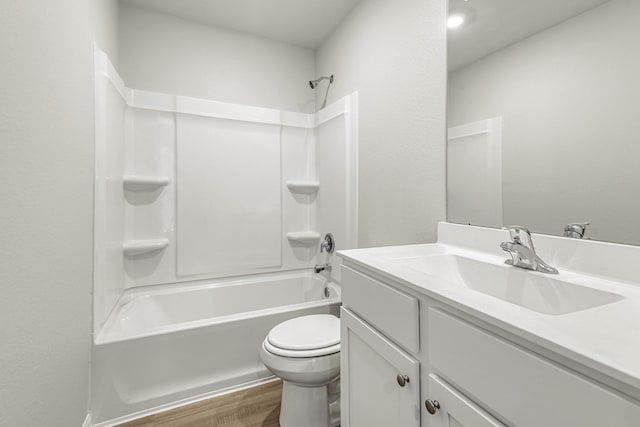 full bath featuring toilet, shower / bathing tub combination, vanity, and wood finished floors