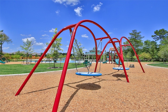 community play area with a lawn