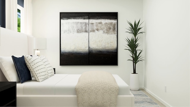 carpeted bedroom featuring baseboards