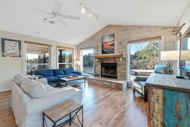 1222 Harts Creek Rd, Trinity, TX 75862 - living area featuring a ceiling fan, rail lighting, and a healthy amount of sunlight