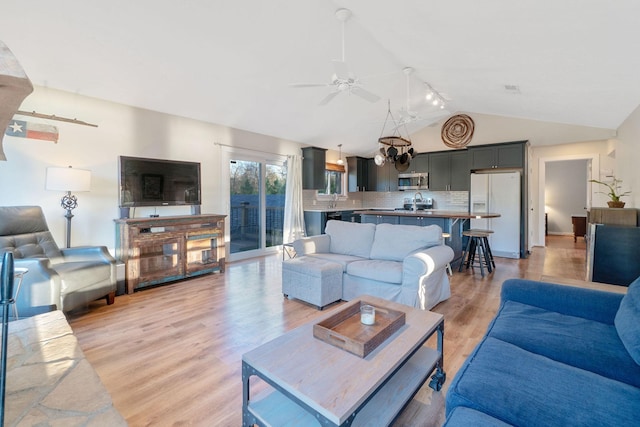1222 Harts Creek Rd, Trinity, TX 75862 - living area featuring light wood-type flooring, vaulted ceiling, and ceiling fan