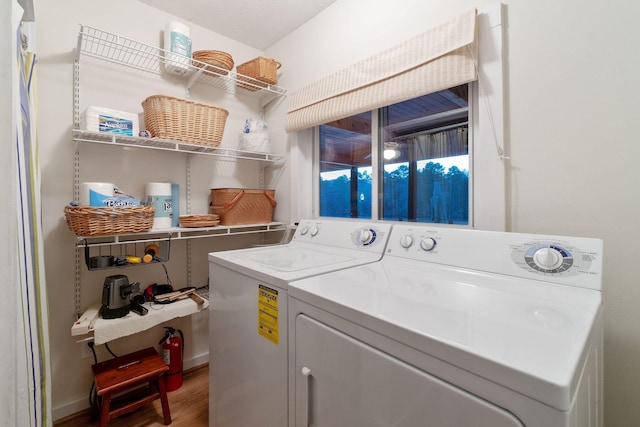 1222 Harts Creek Rd, Trinity, TX 75862 - laundry area featuring independent washer and dryer, wood finished floors, and laundry area