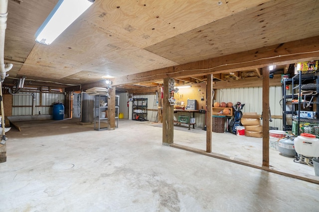 1222 Harts Creek Rd, Trinity, TX 75862 - unfinished basement with water heater