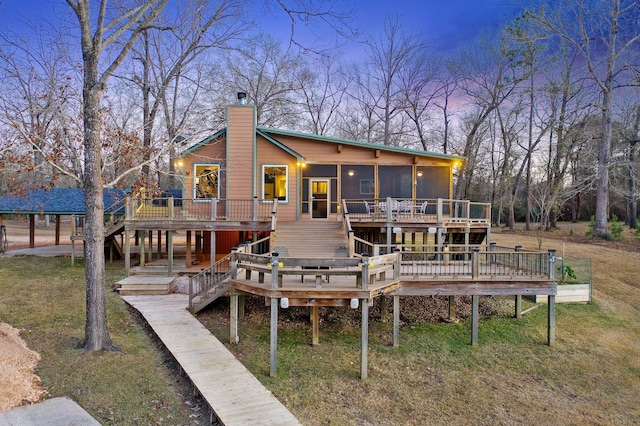 1222 Harts Creek Rd, Trinity, TX 75862 - back of house featuring stairway, a chimney, a yard, and a deck