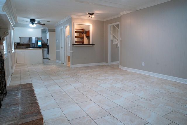 unfurnished living room featuring a ceiling fan, baseboards, and crown molding