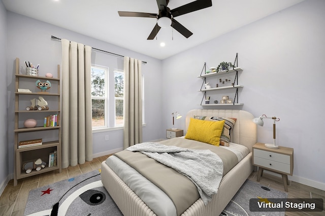 bedroom with recessed lighting, wood finished floors, and baseboards