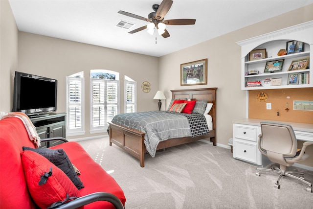 bedroom featuring light carpet, a ceiling fan, visible vents, and baseboards
