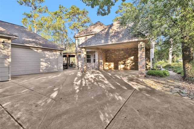 exterior space featuring brick siding and a garage