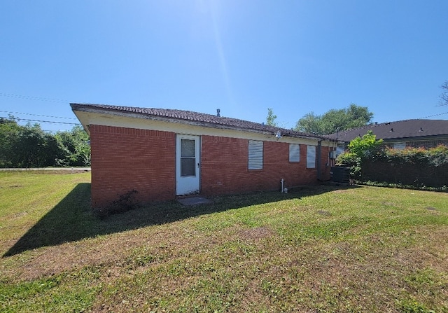 6710 Fairwood Rd, Hitchcock, TX 77563 - exterior space with brick siding and a lawn