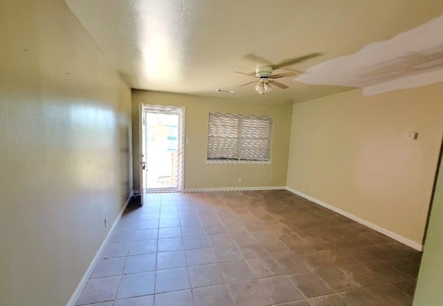 6710 Fairwood Rd, Hitchcock, TX 77563 - unfurnished room featuring visible vents, tile patterned floors, baseboards, and ceiling fan
