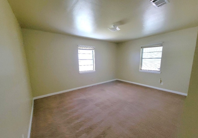 6710 Fairwood Rd, Hitchcock, TX 77563 - carpeted empty room featuring baseboards and visible vents