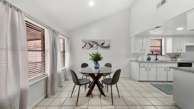 9831 Sagequeen Dr, Houston, TX 77089 - dining room featuring lofted ceiling, visible vents, baseboards, and light tile patterned floors