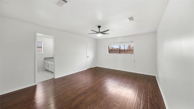 9831 Sagequeen Dr, Houston, TX 77089 - unfurnished bedroom featuring baseboards, dark wood-style flooring, and visible vents