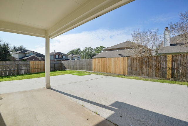 203 Annatto Ln, Crosby, TX 77532 - view of patio / terrace featuring a residential view