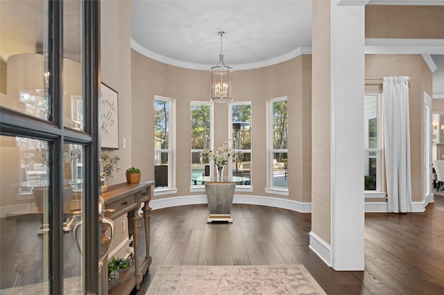 10539 Crestwater Cir, Magnolia, TX 77354 - dining room with a chandelier, dark wood-style floors, ornamental molding, baseboards, and a high ceiling