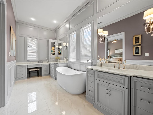 10539 Crestwater Cir, Magnolia, TX 77354 - full bathroom featuring a decorative wall, ornamental molding, marble finish floors, ensuite bathroom, and a soaking tub
