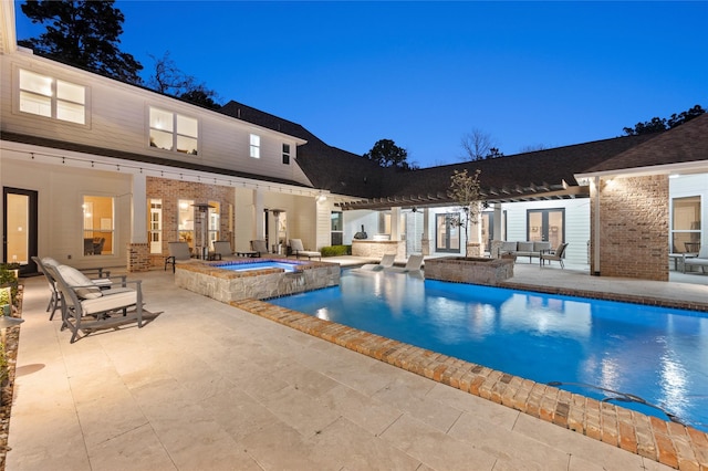 10539 Crestwater Cir, Magnolia, TX 77354 - rear view of house featuring an outdoor hangout area, a patio area, a pergola, and exterior kitchen