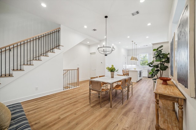 dining room featuring recessed lighting, light wood-type flooring, visible vents, and baseboards