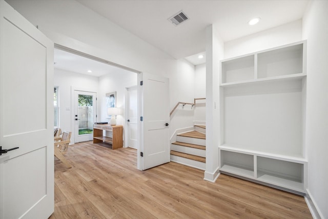 mudroom with light wood-style floors, visible vents, and recessed lighting