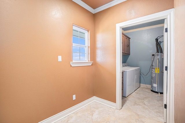 clothes washing area with washing machine and dryer, electric water heater, baseboards, cabinet space, and crown molding
