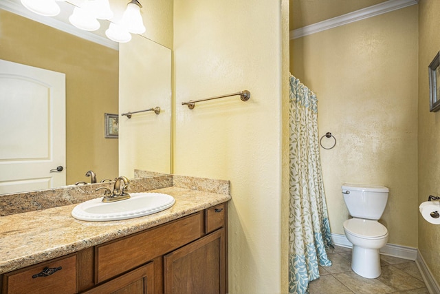 full bathroom with toilet, crown molding, vanity, and tile patterned floors