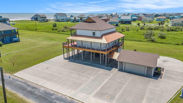 birds eye view of property with a water view and a residential view