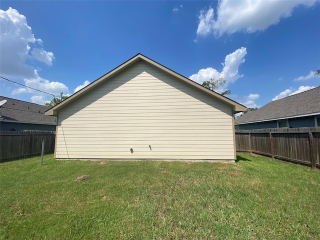 8046 Parker Rd, Houston, TX 77078 - view of home's exterior with a yard and a fenced backyard