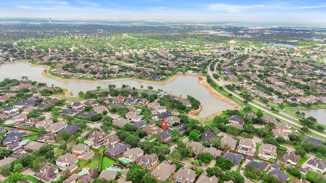 drone / aerial view with a residential view and a water view