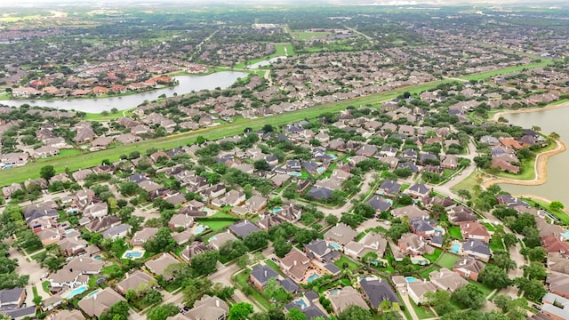 bird's eye view with a residential view and a water view