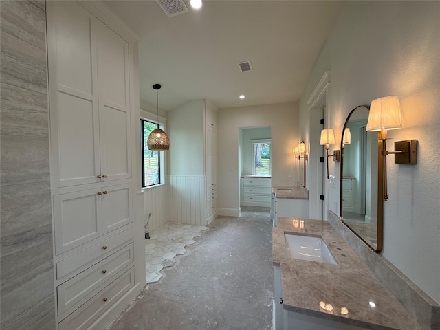 15420 Highlander Ct, Montgomery, TX 77356 - bathroom with healthy amount of natural light, vanity, and wainscoting