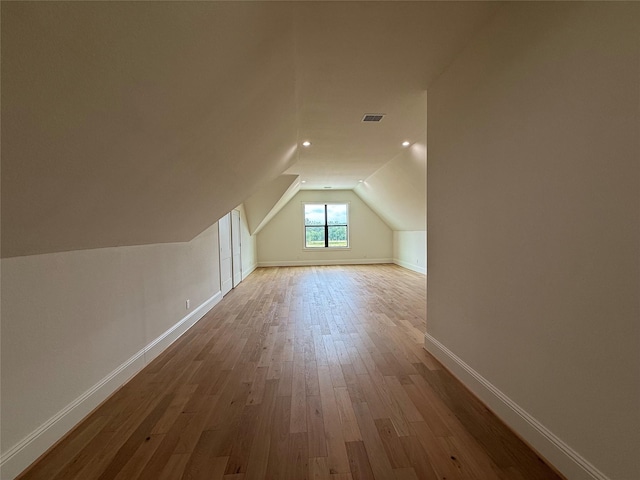 15420 Highlander Ct, Montgomery, TX 77356 - additional living space with vaulted ceiling, wood finished floors, baseboards, and recessed lighting