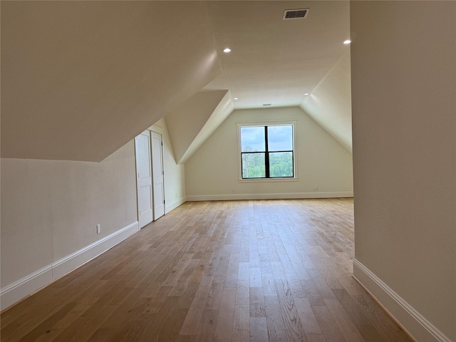 15420 Highlander Ct, Montgomery, TX 77356 - bonus room featuring wood finished floors, lofted ceiling, baseboards, and recessed lighting