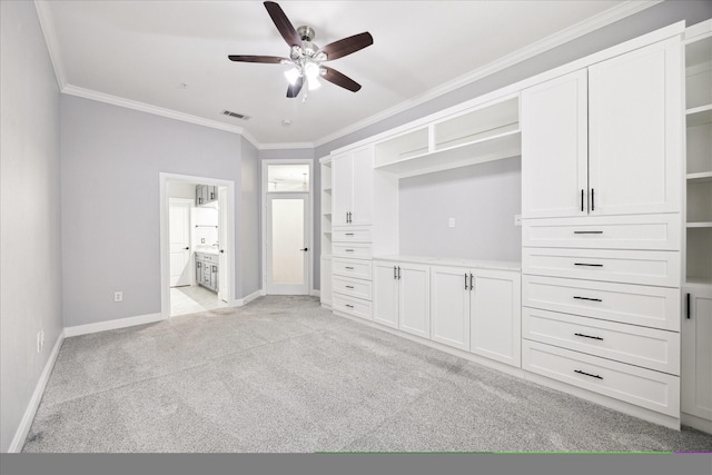 unfurnished bedroom featuring ensuite bathroom, light colored carpet, baseboards, ornamental molding, and visible vents