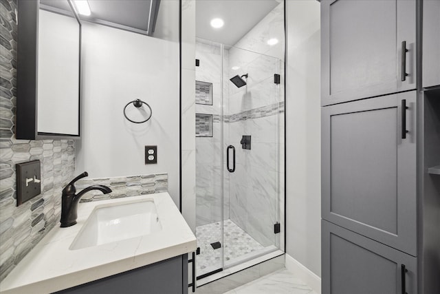 full bath featuring recessed lighting, a shower stall, marble finish floor, and vanity