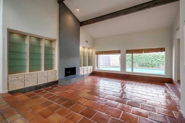 1319 E Brooklake Dr, Houston, TX 77077 - unfurnished living room featuring tile patterned floors, high vaulted ceiling, beamed ceiling, baseboards, and a large fireplace