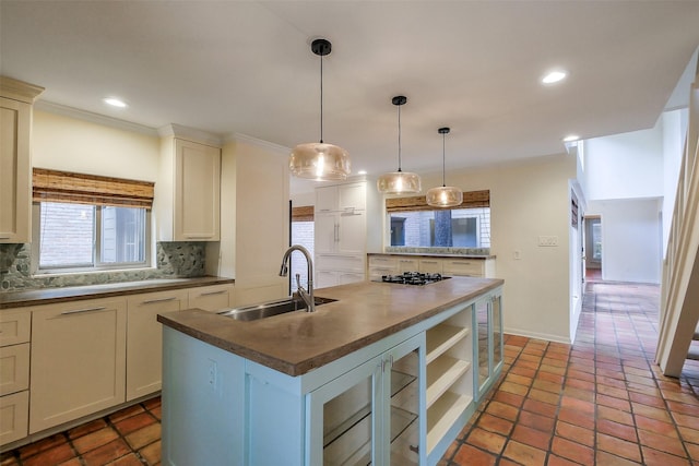1319 E Brooklake Dr, Houston, TX 77077 - kitchen featuring decorative backsplash, a sink, gas stovetop, and plenty of natural light