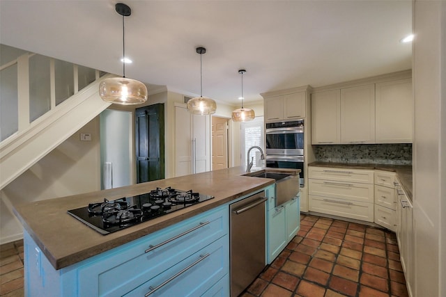 1319 E Brooklake Dr, Houston, TX 77077 - kitchen featuring a sink, decorative backsplash, pendant lighting, stainless steel appliances, and white cabinets