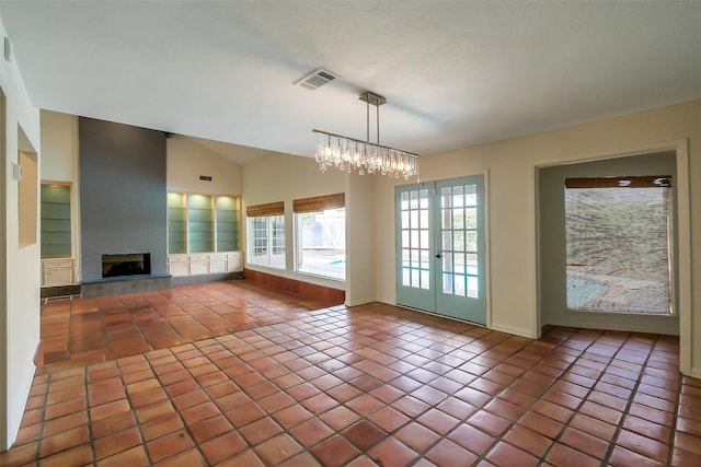 1319 E Brooklake Dr, Houston, TX 77077 - unfurnished living room featuring visible vents, tile patterned floors, a large fireplace, and french doors