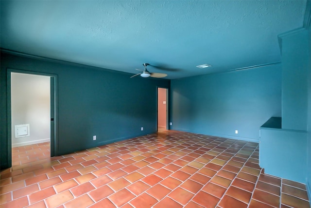 1319 E Brooklake Dr, Houston, TX 77077 - spare room featuring a textured ceiling, baseboards, and ceiling fan