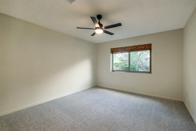 1319 E Brooklake Dr, Houston, TX 77077 - empty room featuring ceiling fan, baseboards, a textured ceiling, and carpet